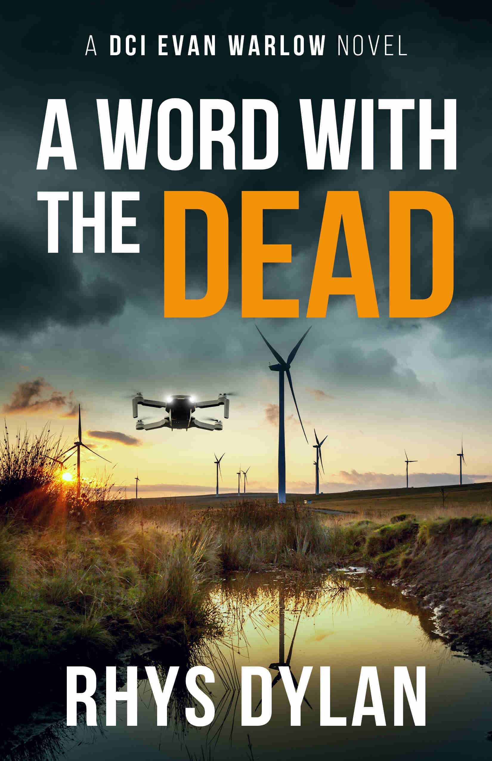 A Word With the Dead by Rhys Dylan, DCI Evan Warlow Book 17. Drone over a field with wind turbines and a pool at dusk.