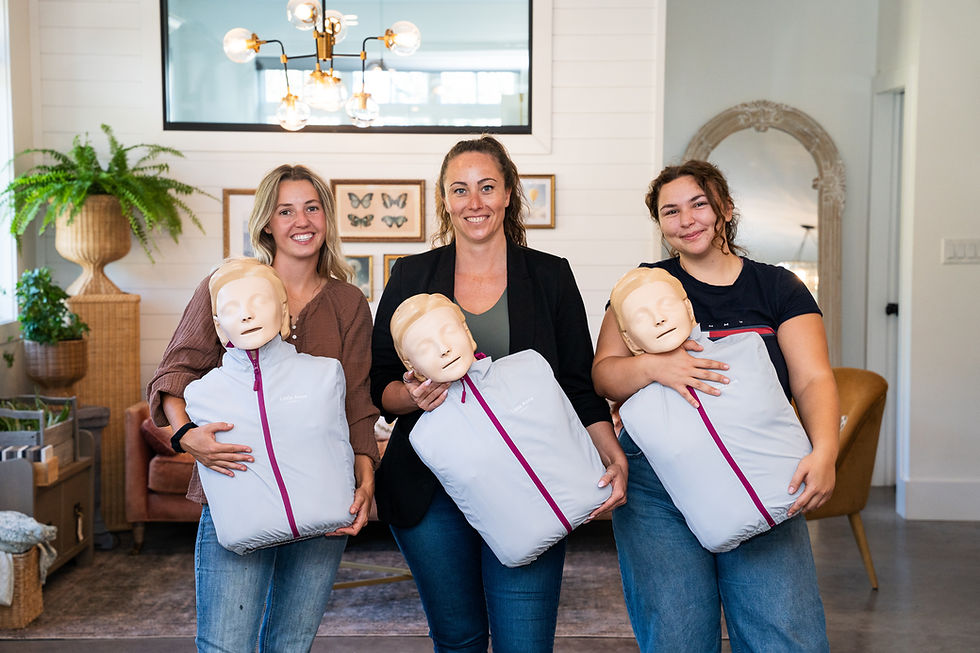 Acute First Aid class holding their first aid training certificates