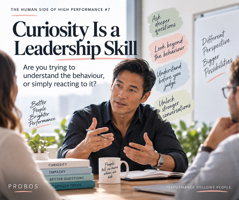 A leader listens and asks questions during a discussion about understanding behaviour before judging it.