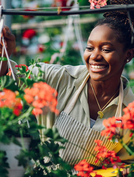 african-american-woman-working-in-a-greenhouse-flo-2022-09-22-01-18-32-utc-scaled.jpeg