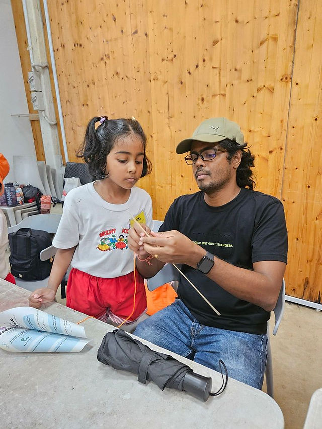 Children receiving medals from parents