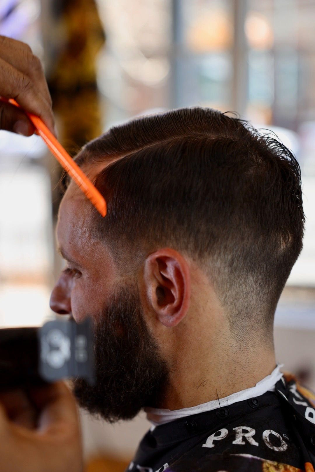 Barber doing clipper cut