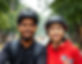 two young people around 18 years old wearing bicycle helmet indian and chinese _edited.jpg