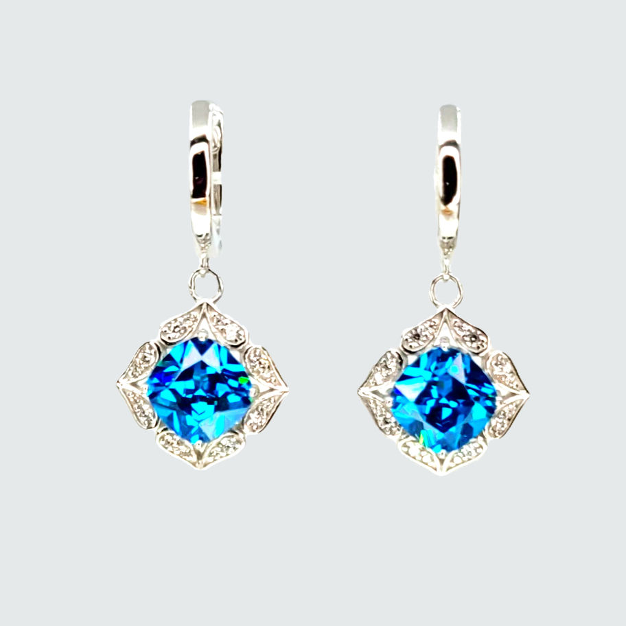 Earrings with central blue coushin cut Topaz surrounded with white Topaz set in silver .925