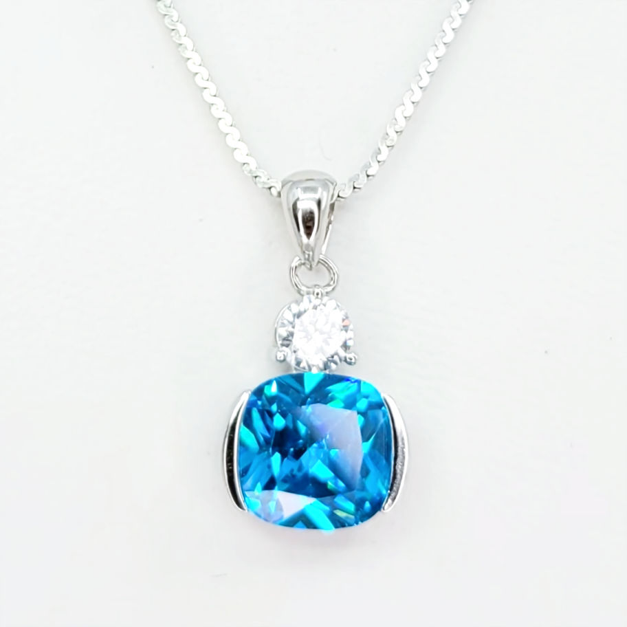 Silver pendant with coushin cut blue Topaz