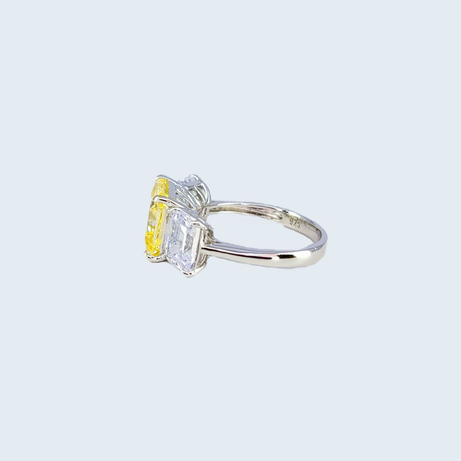Silver ring with canary yellow and white Topaz