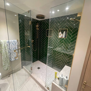 Modern Bathroom with Green Herringbone Tiles