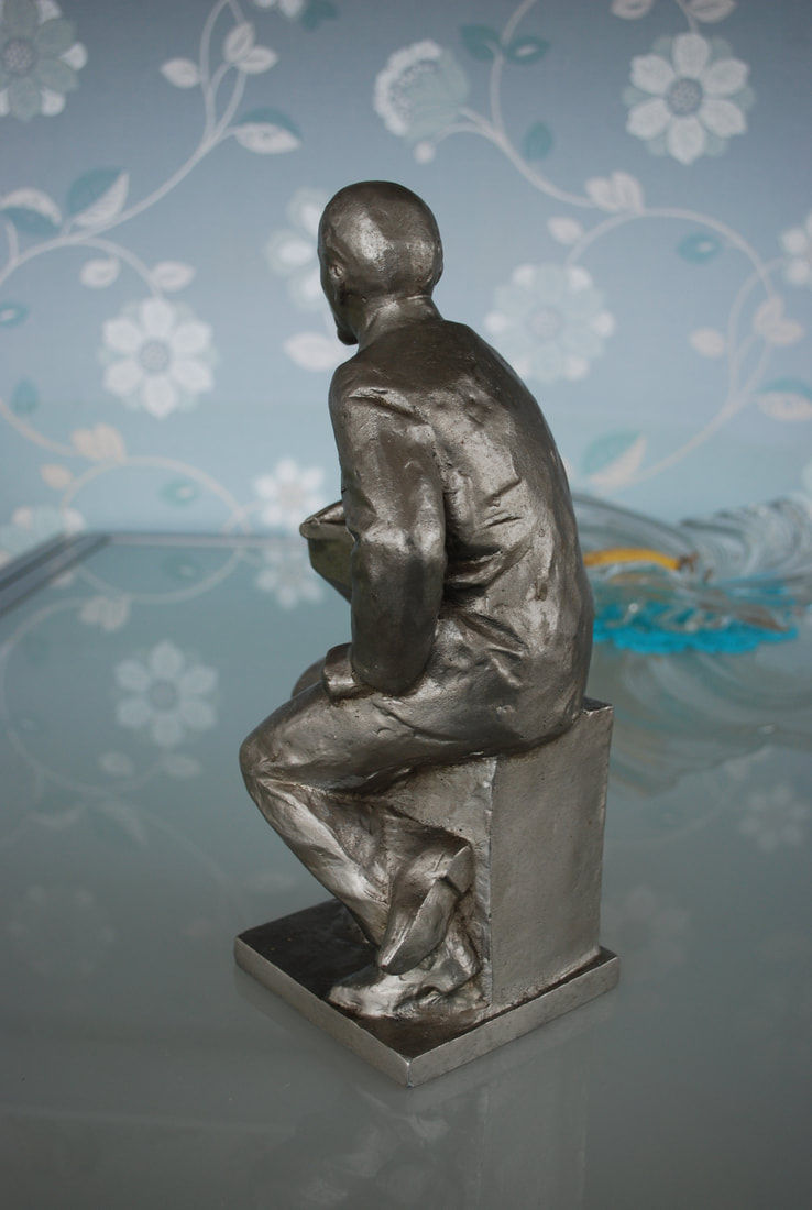 Thumbnail: Statue Lenin Sitting At Desk With Book