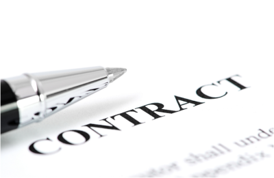 Close-up view of a contract and calculator on a desk