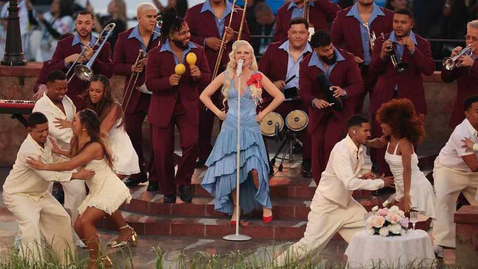 Lady Gaga, the salsa band, and dancers (Patrick T. Fallon, AFP via Getty)