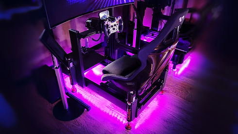 Vthrotl Pro racing simulator with Vero Motion haptics and purple under lighting