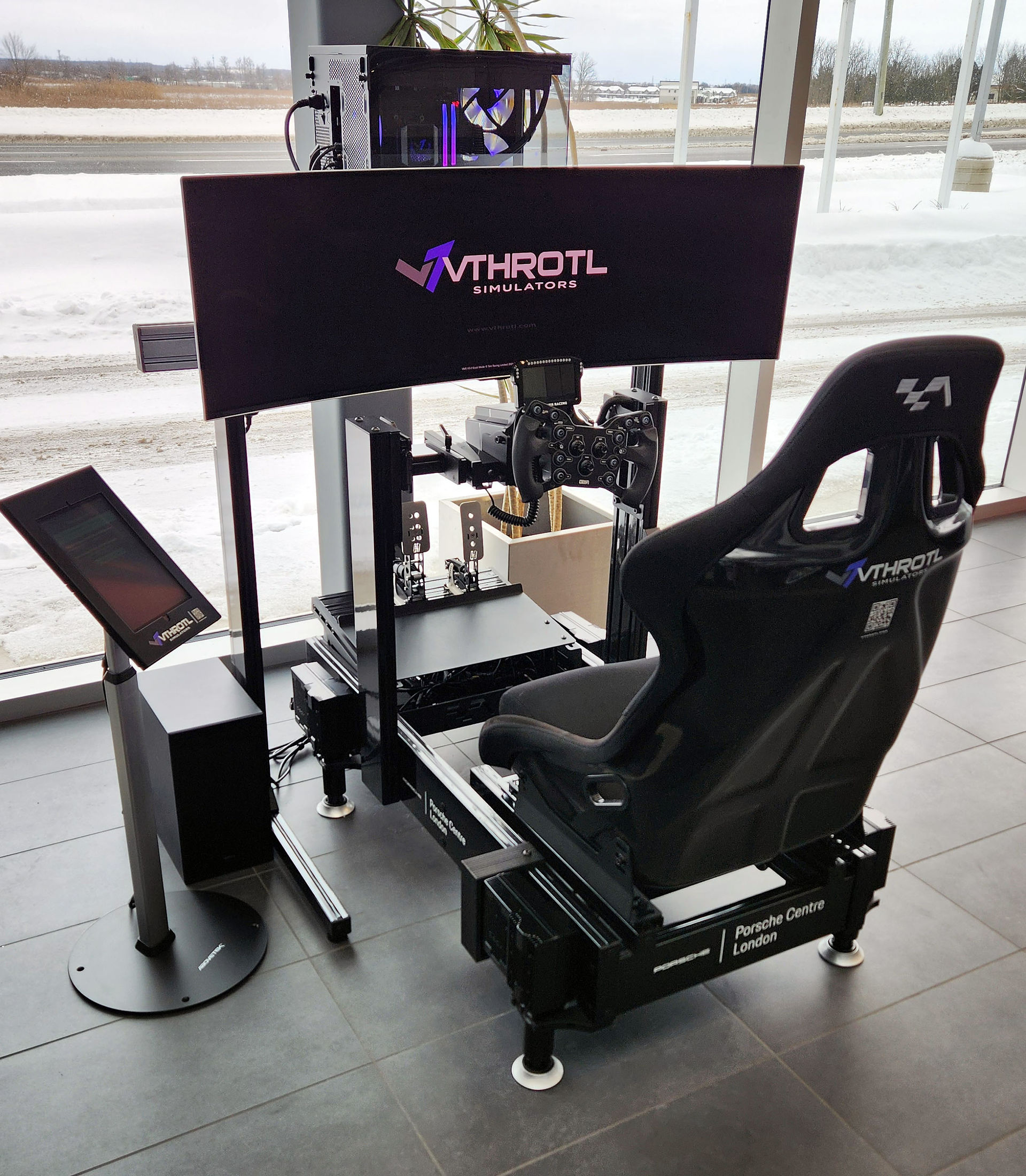 A Vthrotl Pro Series racing simulator installed at Porsche Centre London.  Featuring an ultrawide monitor, performance custom gaming PC,  ASR Pro chassis.