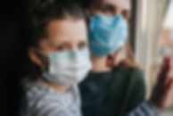 Mother and daughter in masks