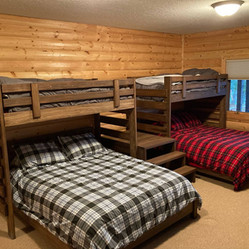 Custom Twin loft beds with full platform beds in bunkbed room. Custom stain color and custom stairs in between loft beds.