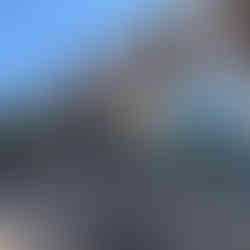 Row of stores at The Crossing Clarendon including Soul Cycle and Chip CIty, with the breezeway to the Alliance Gallery.