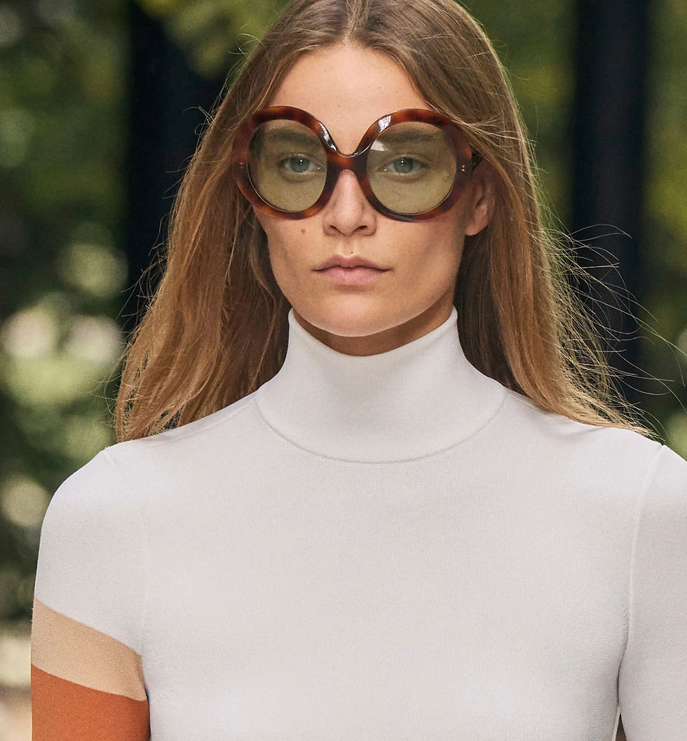 A female model wearing oversized Celine sunglasses