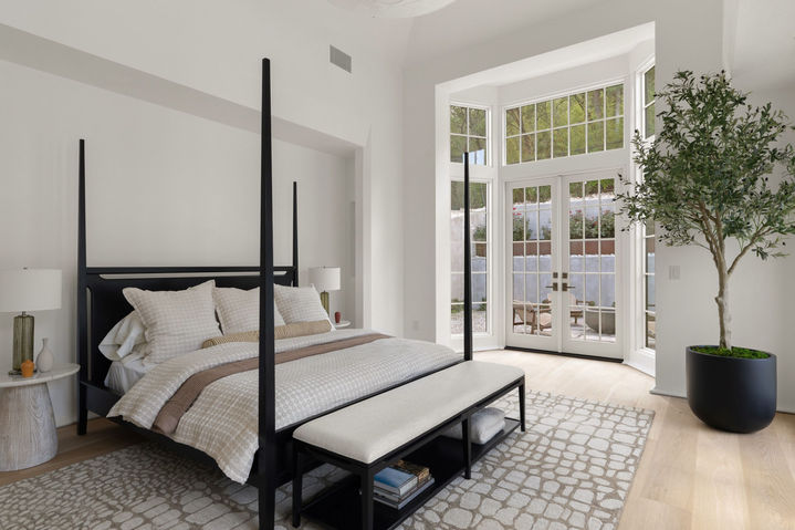 Primary bedroom with canopy bed at The Lantern