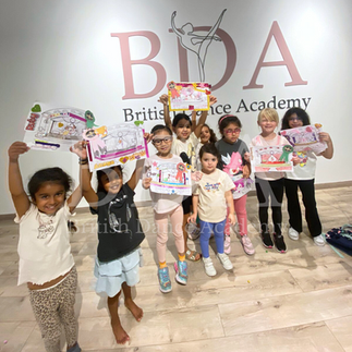 Kids showcasing their artwork at Summer camp at British Dance Academy in Dubai.