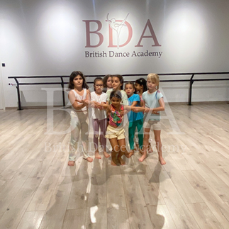 Kids in position to start their AcroDance routine at Summer camp at British Dance Academy in Dubai.