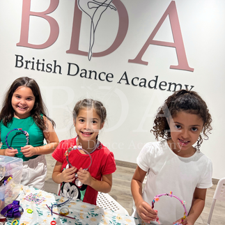 Kids showing off their craft hair bands at Spring dance camp at British Dance Academy in Dubai. 