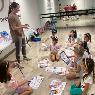 Kids getting awarded for their artwork competition at Summer camp at British Dance Academy in Dubai.