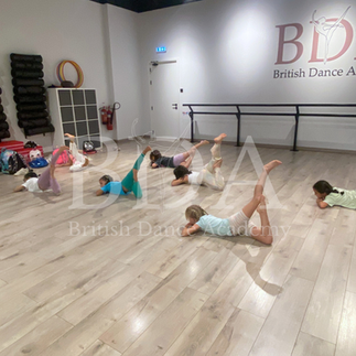 Kids in the middle of their acrodance class at Summer camp in British Dance Academy in Dubai.