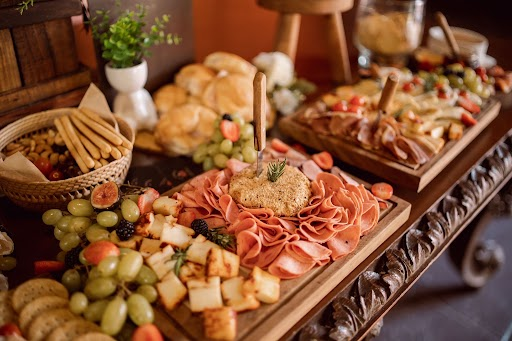 A charcuterie and cheese grazing platter styled for an Anchorage wedding reception, prepared by Sis's Cafe and Catering.