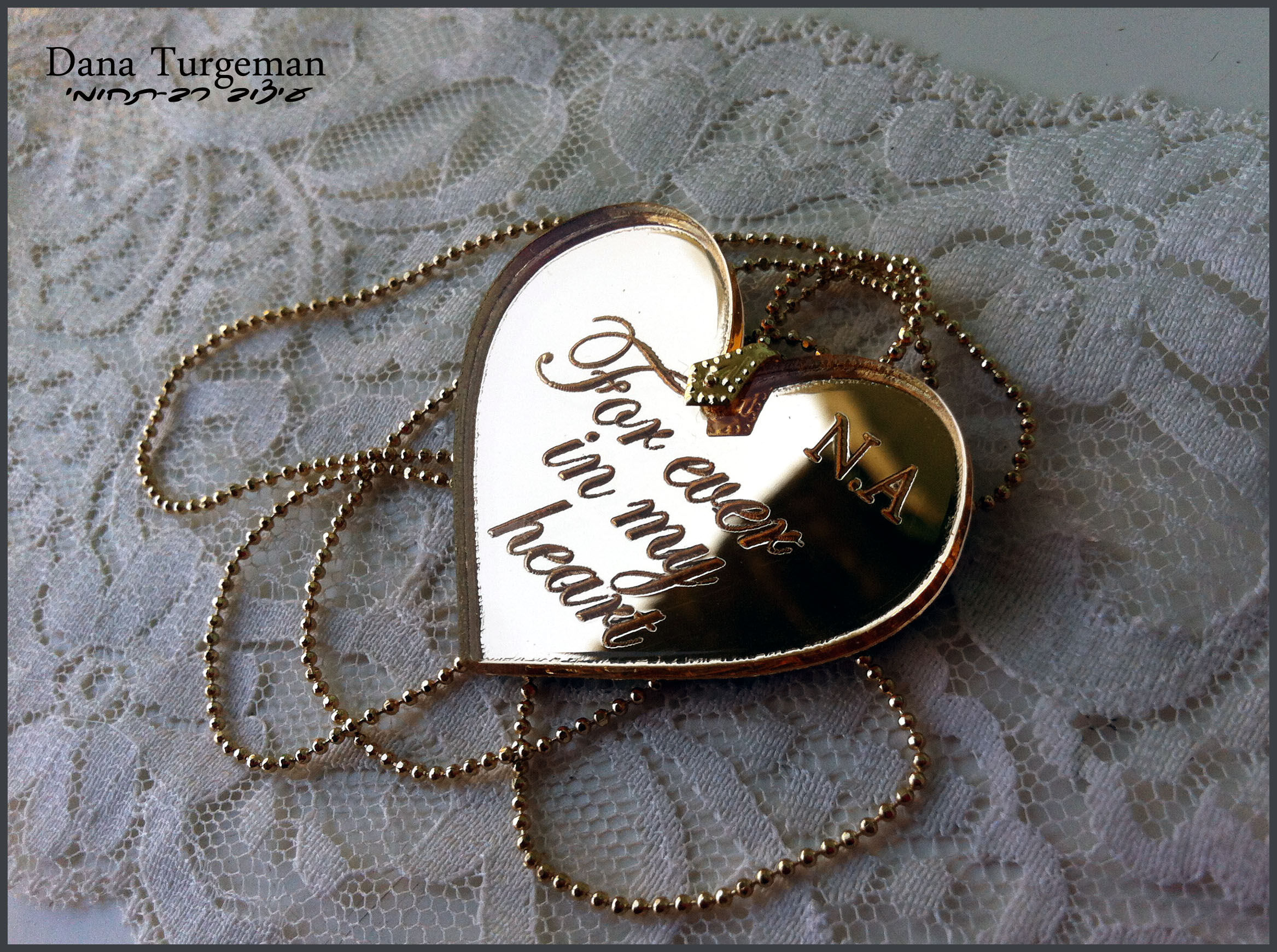 A golden mirror L heart necklace