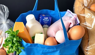 Bag of groceries with milk, cheese, eggs, chicken, and bread.jpg