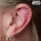 Triple helix piercing with Ember Body Jewelry from Luna Piercing and Fine Jewelry. Pierced by Jamie