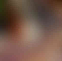 4 colors of yarn on a knit blanket