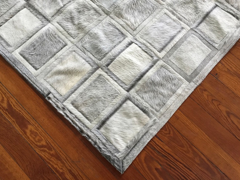 Thumbnail: Belgrano cowhide patchwork rug with framed square design filling the floor