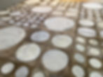 Thumbnail: Lujan hide rug in dark taupe, off white, and cream on a modern living room floor, handmade luxury cowhide rug by Lifestyle by