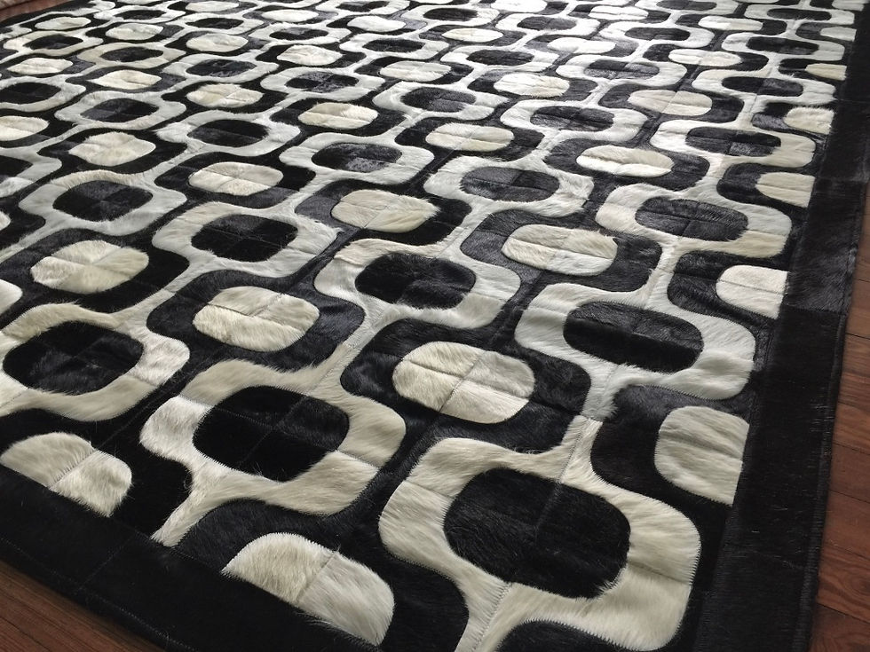 Thumbnail: Modern cow hide rug with tiled pattern from Lifestyle by Cara on a wood floor