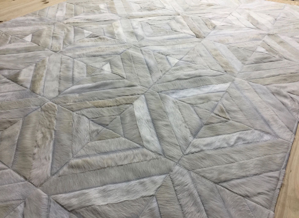 Thumbnail: Urquiza hide rug in a 30 x 30 cm diamond layout on a modern living room floor, handmade from premium cow hide and hair‑on hid