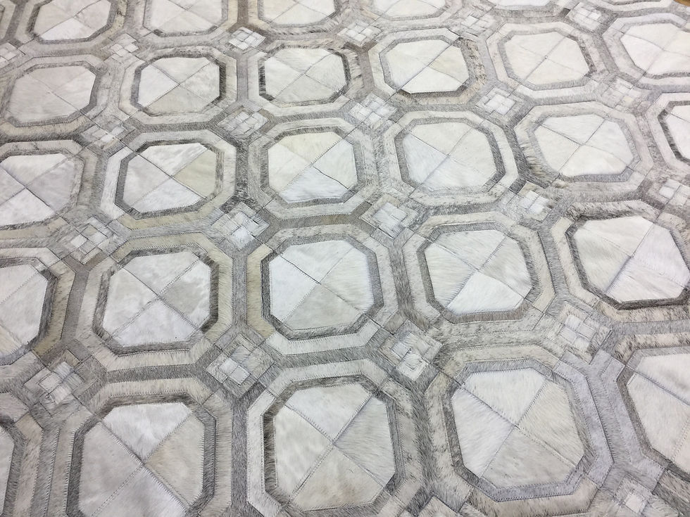 Thumbnail: Casanova cowhide patchwork rug available in off‑white, off‑white + taupe + light grey, black & white + taupe, and other custo