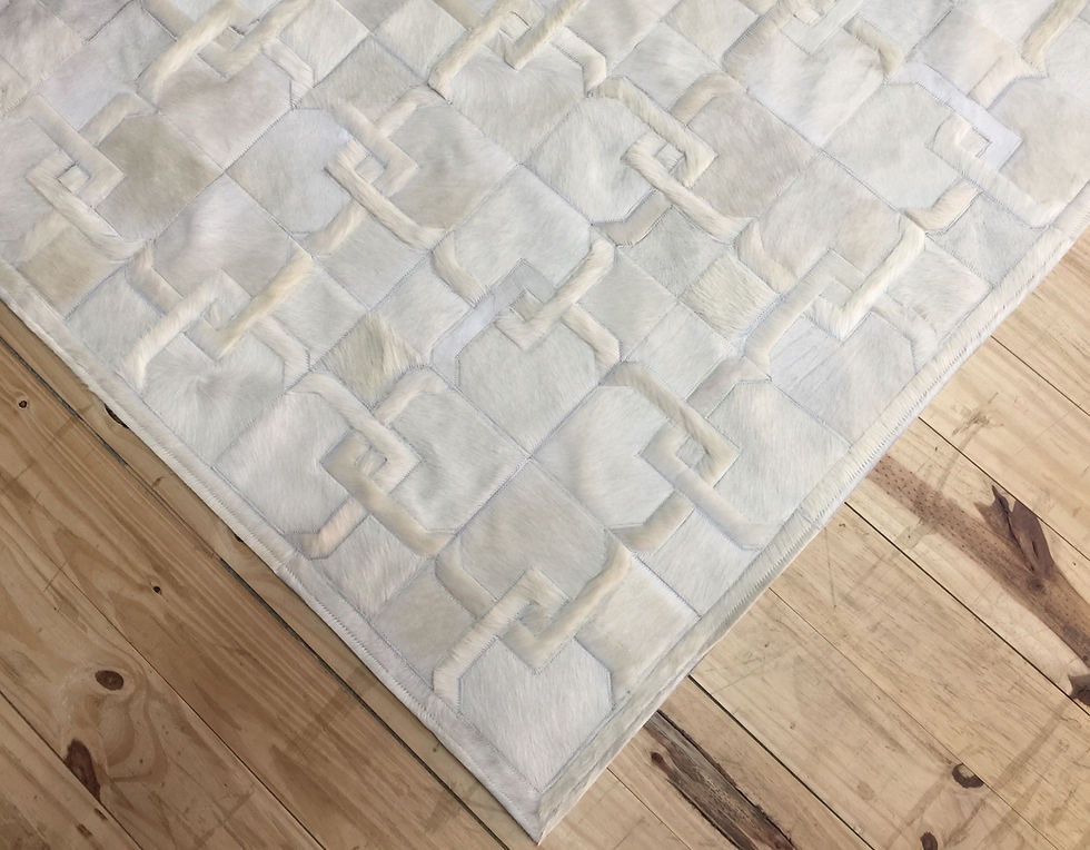Thumbnail: Alvear cowhide rug in black, off white, and light grey on a modern living room floor, handmade graphic hide rug by Lifestyle