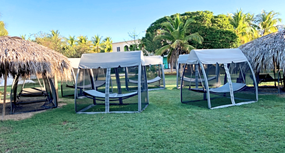 multiple screened hammock tents in the medicine space at Doranja House