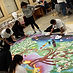 The project was inspired by award-winning children’s author Kate Seredy’s story of a World War I battle during which Hungarian soldiers crawled all night through total desolation. When they reached safety, there was one tree still standing, and hundreds of birds of varying species were singing together, birds that do not naturally do so, creating a unique and beautiful song.
In 1999, that story inspired an 8-year-old girl to wonder what would happen if people from all over the world, from different backgrounds and traditions, came together to make something beautiful like the birds’ song. She asked, “What if the whole world made a painting together?”
Today, a forest of “Singing Tree” paintings have been created by almost 12,000 people worldwide, according to Laurie Marshall, co-founder of the Singing Tree project. Each painting explores a theme and honors the essential role trees play in human life.
This project came to Ukiah after UHS teacher Eveline Rodriguez attended a summer seminar where Marshall shared information about her project. With support from fellow MESA teacher Sezgin Ramirez and MESA director Matt Sweeney, Rodriguez enlisted their MESA students in an ambitious project to create the 49th singing tree mural.
The name of the Ukiah High tree is the Manzanita Singing Tree of Kindness, and in it, students use art to explore questions such as, “What is a memorable act of kindness that you received or gave?” and “Is there someone you were unkind to whose trust you need to restore?”
Marshall coordinated the project, coming to Ukiah on Dec. 5, 12 and 19. She asked students to draw their visions of kindness and she incorporated those visions into a final mural design. She then encouraged project participants to invite students outside the MESA class to decorate the manzanita tree by creating leaves where they shared their ideas about kindness.
Rodriguez said, “Almost 50 MESA students were involved, and everyone had a role. We had committees responsible for preparing the leaves, for creating instructions so others could participate, for painting the mural, for figuring out where to display it once it’s done, and many others.”
The project not only produced a beautiful work of art, it incorporated several academic subjects, as well as enhancing students’ social and emotional development.
MESA students learned about the role of manzanita trees in local ecology. They used mathematics to create the grid to enlarge the master design, and they used engineering to design and build the free-standing mural with the help of the woodshop students.
They also used communication skills as they collaborated with classmates and invited others to participate by adding to the mural or documenting the project for the yearbook. Students expanded their social and emotional learning as they explored kindness; and finally, they used creative expression as they produced unique images that reflected their personal understanding of kindness.
Rodriguez said she was pleased so many colleagues chose to have their classes participate.
“More than a dozen teachers from many different departments got involved, like English, psychology, PE, science, art, independent study, special education, and foreign language,” she said.
Part of the project included more than contemplating kindness: students who shared memorable acts of kindness were encouraged to continue to practice those acts, and students who shared stories about needing to restore trust or apologize were encouraged to follow up and make amends.
“For the students who participated, I think this project created awareness about kindness, and how important it is. I also think it gave them hope. It showed them they can make changes when they believe in themselves. We did this project in three weeks. We can do so much more when we work together.”
To learn more about the Singing Tree project, visit www.unitythroughcreativity.net/programs/singing-tree-forest. Marshall and co-founder Lili Lopez also work with an international non-profit whose mission is peace-building through art (createpeaceproject.org).
By Ukiah Daily Journal | udj@ukiahdj.com |
PUBLISHED: January 23, 2018 at 12:00 am | UPDATED: August 23, 2018 at 12:00 am (used with permission)