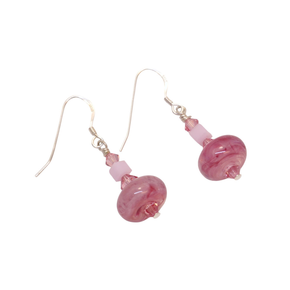 Pink lampwork earrings on a white background
