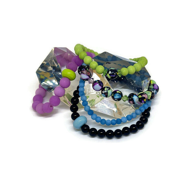 Thumbnail: colorful gemstone bracelets on a white background