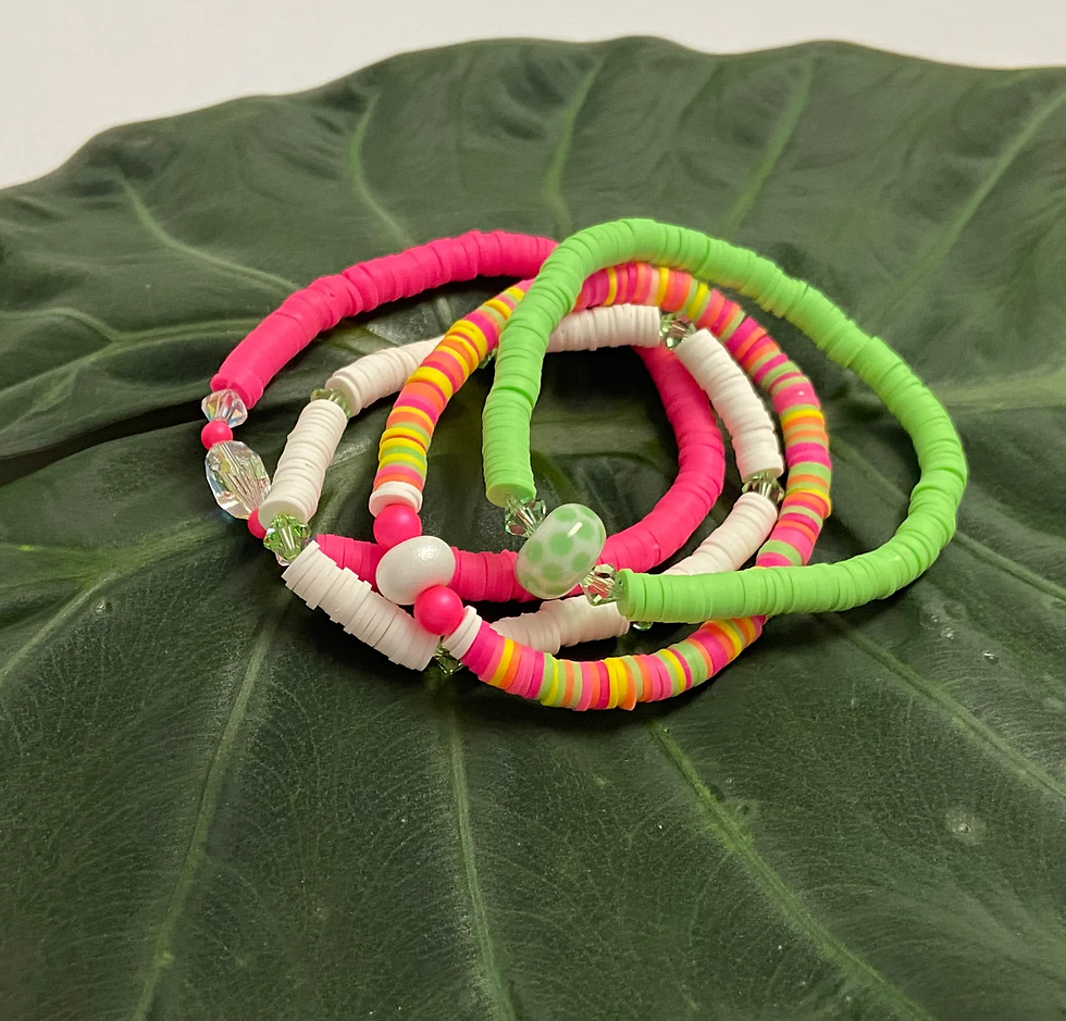 Thumbnail: colorful stretch bracelets on a green leaf