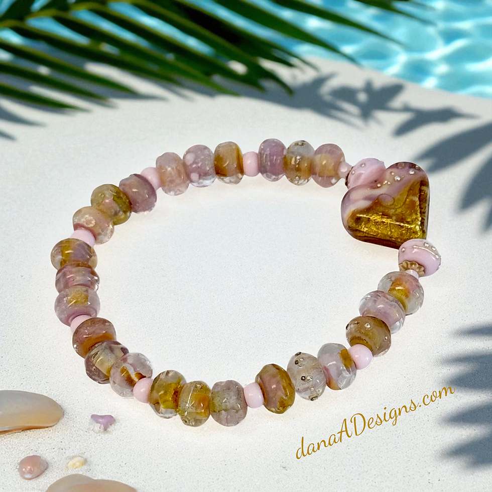 Thumbnail: lampwork bead heart bracelet on a tropical beach