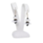 White and Black glass earrings on earring display