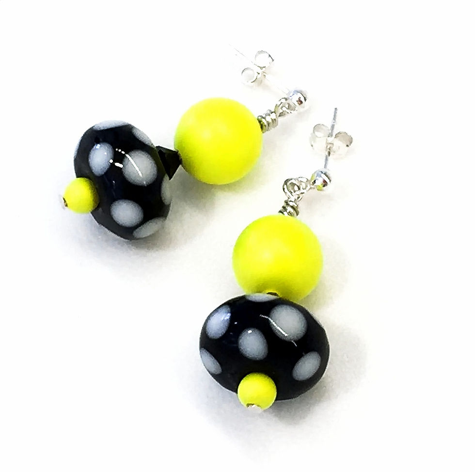 retro neon yellow lampwork glass earrings laying flat