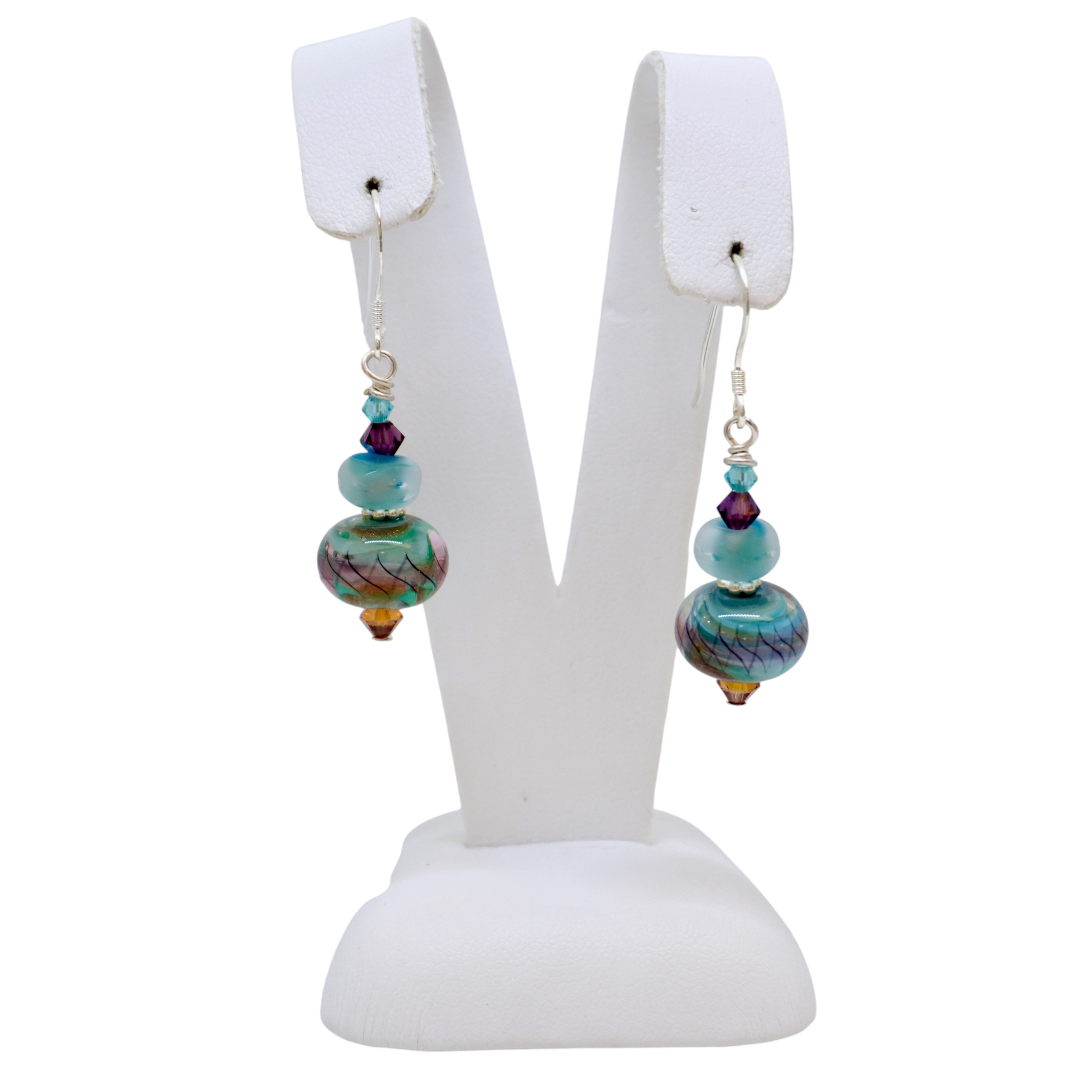 Lampwork glass beads on a white earring display