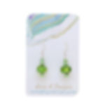 green lampwork glass earrings on an earring card