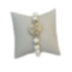 white lava and lampwork starfish bead bracelet on a white pillow