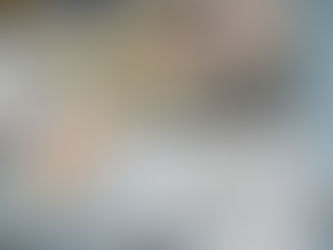 Pills in blister packs and a $50 bill arranged on a light blue surface, suggesting a theme of healthcare costs or medication expenses.