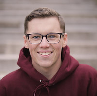 person wearing glasses smiling